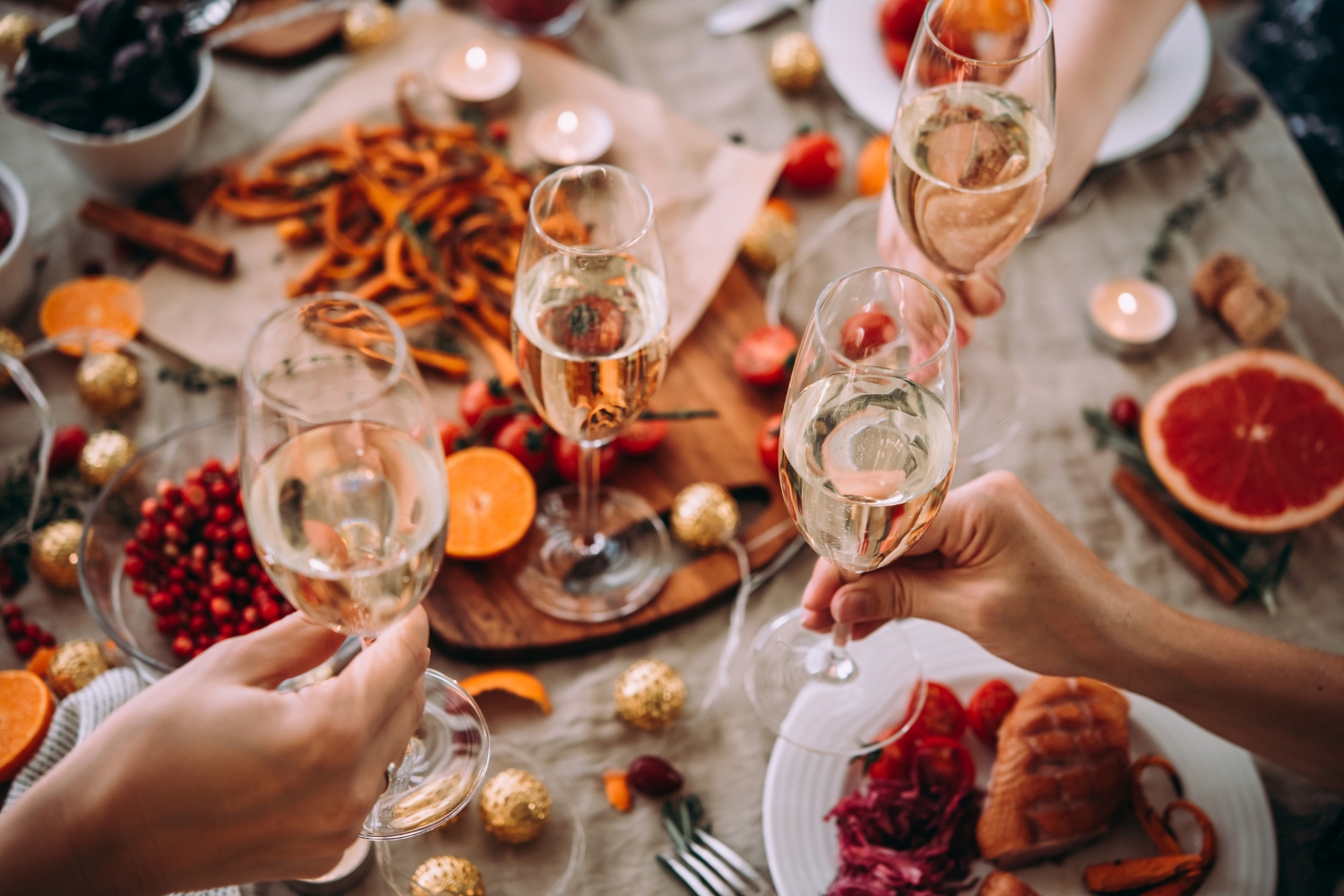 image of Christmas dinner with champagne cheers