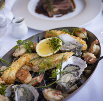 seafood platter, wine and steak dinner