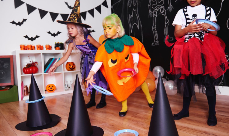 image of kids dressed in Halloween costumes playing Halloween ga