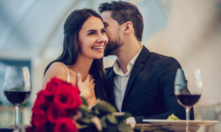 couple sharing a hug during romantic dinner