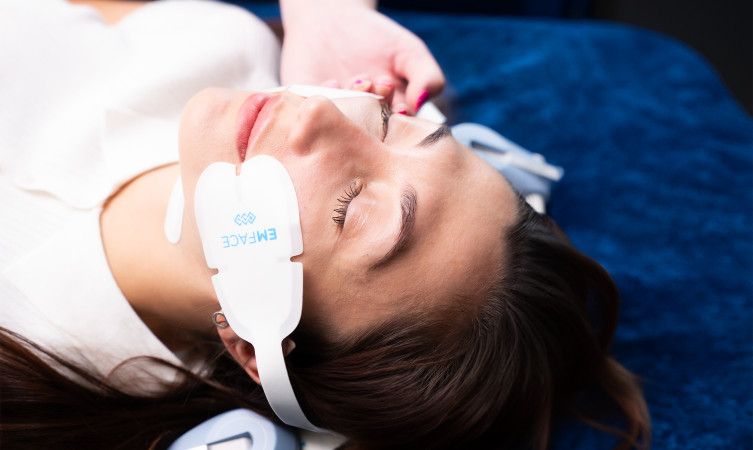 woman with EMFace patches on her face