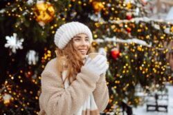 shutterstock 2547079191 girl at Christmas marketing with hot cocoa scaled e1764583306571 - Glenroyal Hotel