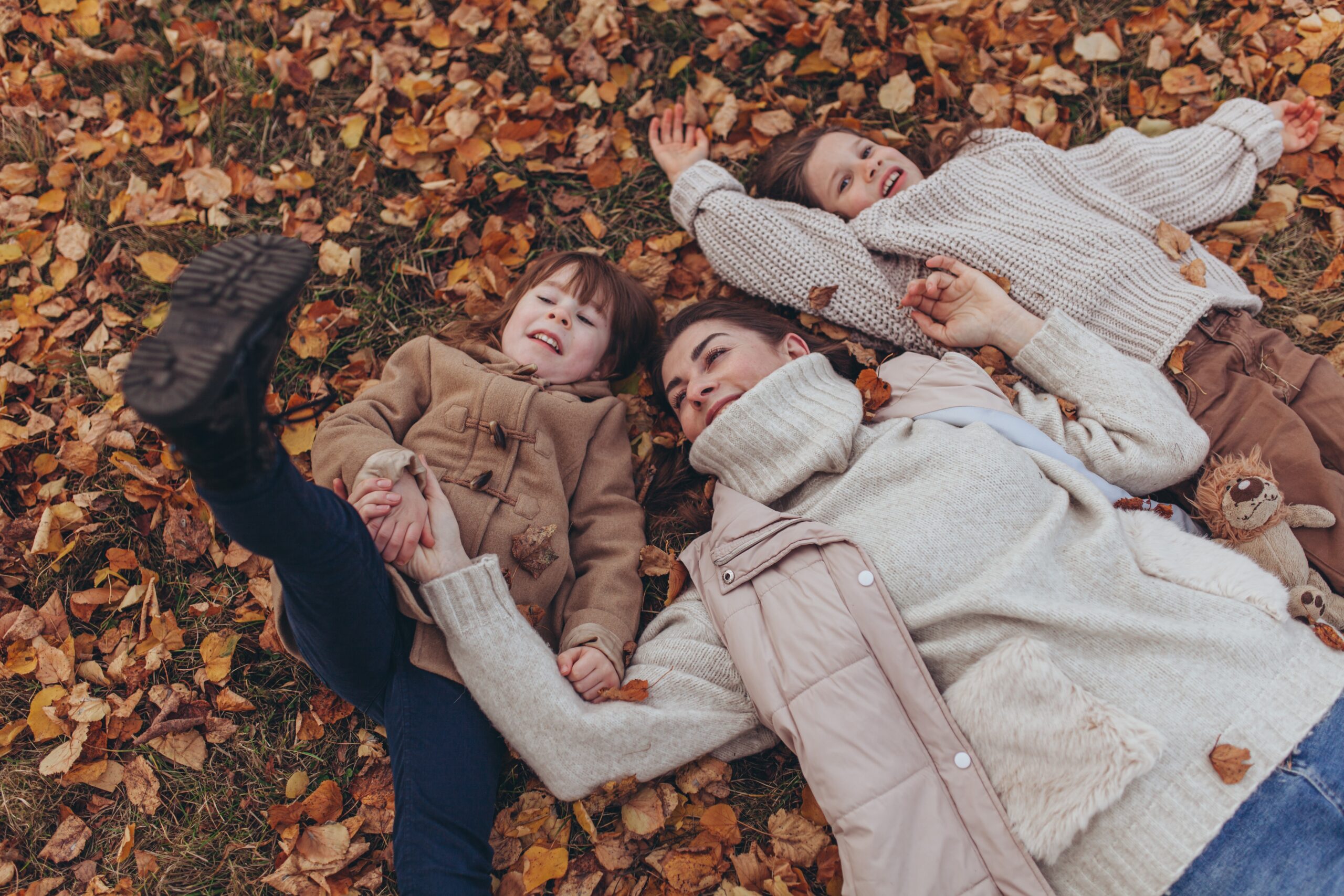 shutterstock 2826214117 family outdoors autumn leaves scaled - Glenroyal Hotel